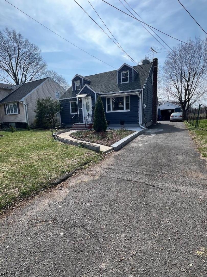220 Terrill Road Plainfield, NJ 07062 - Photo 2 of 15 a view of a big house with a yard and large tree