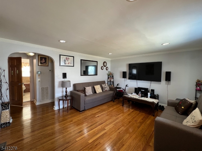 220 Terrill Road Plainfield, NJ 07062 - Photo 3 of 15 a living room with furniture and a flat screen tv
