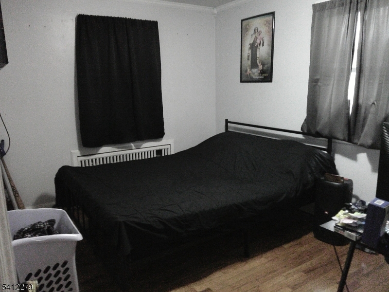 220 Terrill Road Plainfield, NJ 07062 - Photo 7 of 15 a black and white room with wooden floor