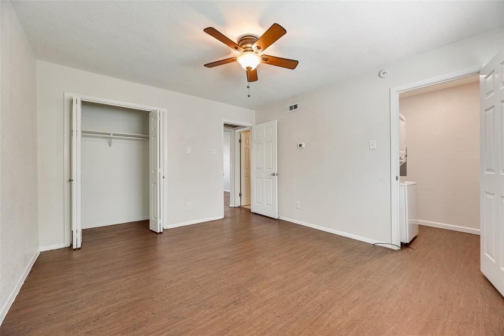 5109 Cedar Springs Road, Unit 115 Dallas, TX 75235 - Photo 10 of 16 Bedroom with a walk in and reach in closet.