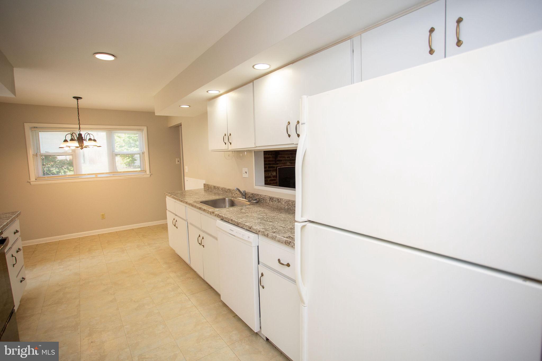 1016 Eagle Lane Cherry Hill, NJ 08003 - Photo 12 of 54 a large kitchen with a sink and a refrigerator