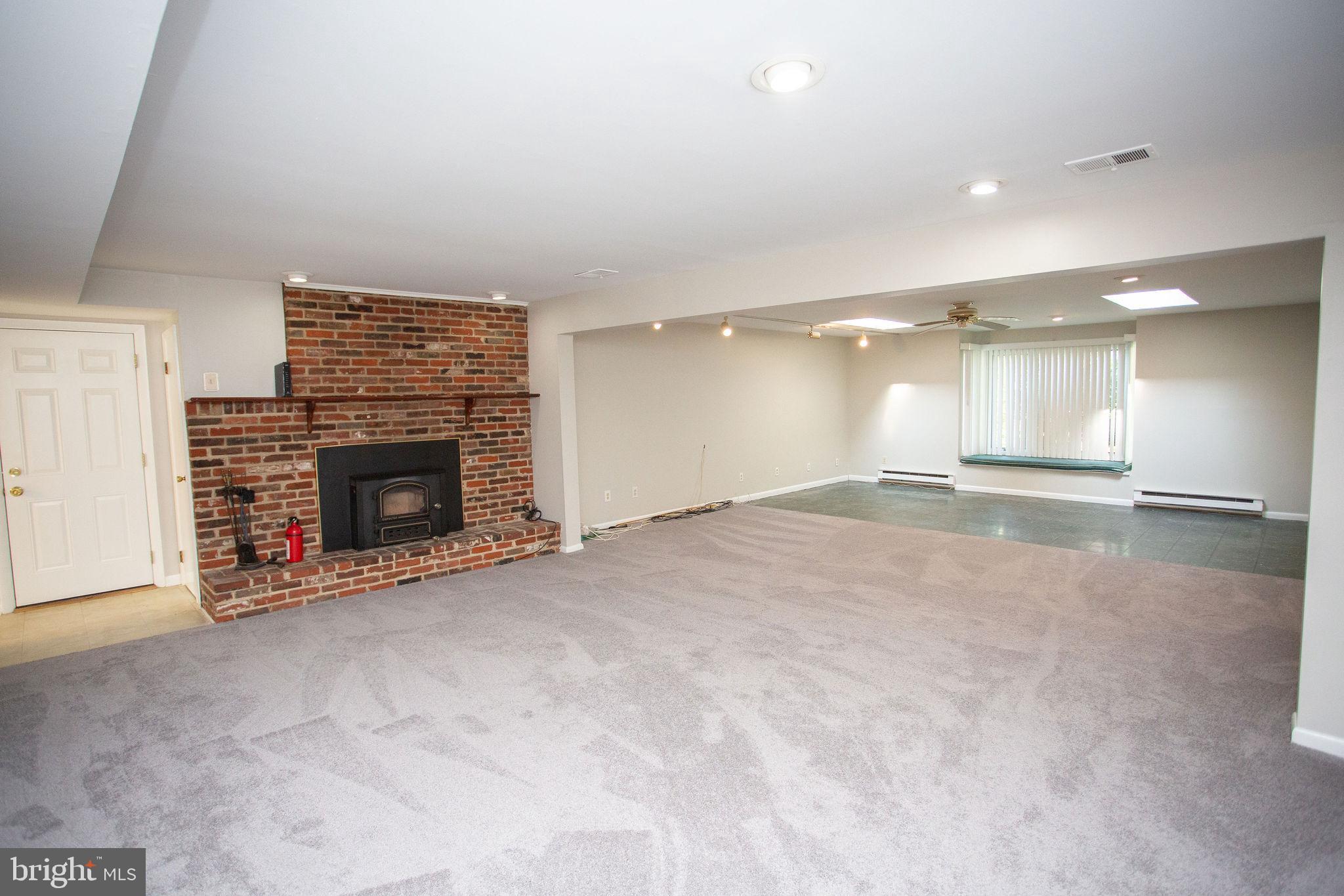1016 Eagle Lane Cherry Hill, NJ 08003 - Photo 16 of 54 an empty room with a fireplace and window