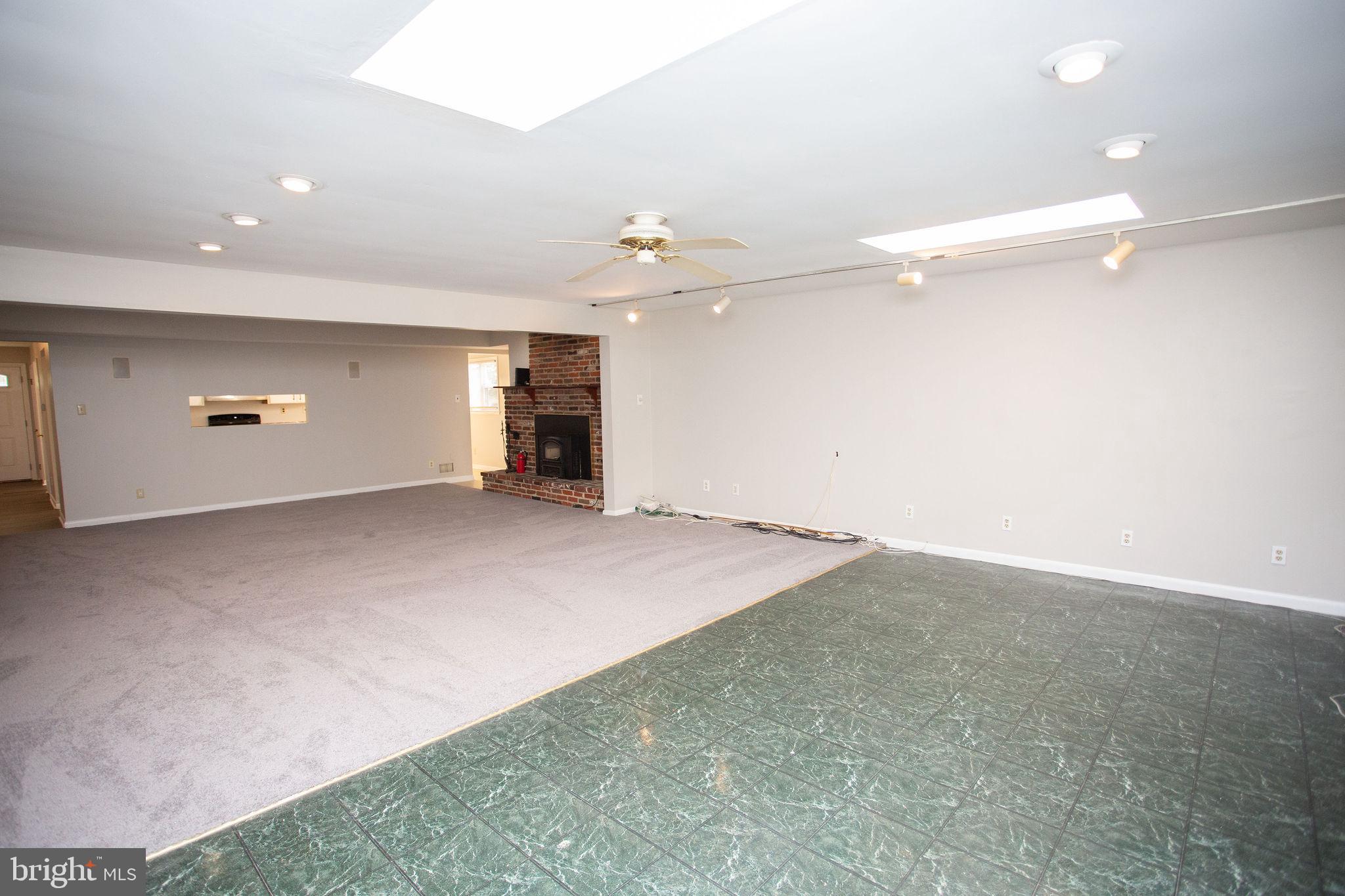 1016 Eagle Lane Cherry Hill, NJ 08003 - Photo 19 of 54 an empty room with a ceiling fan and window