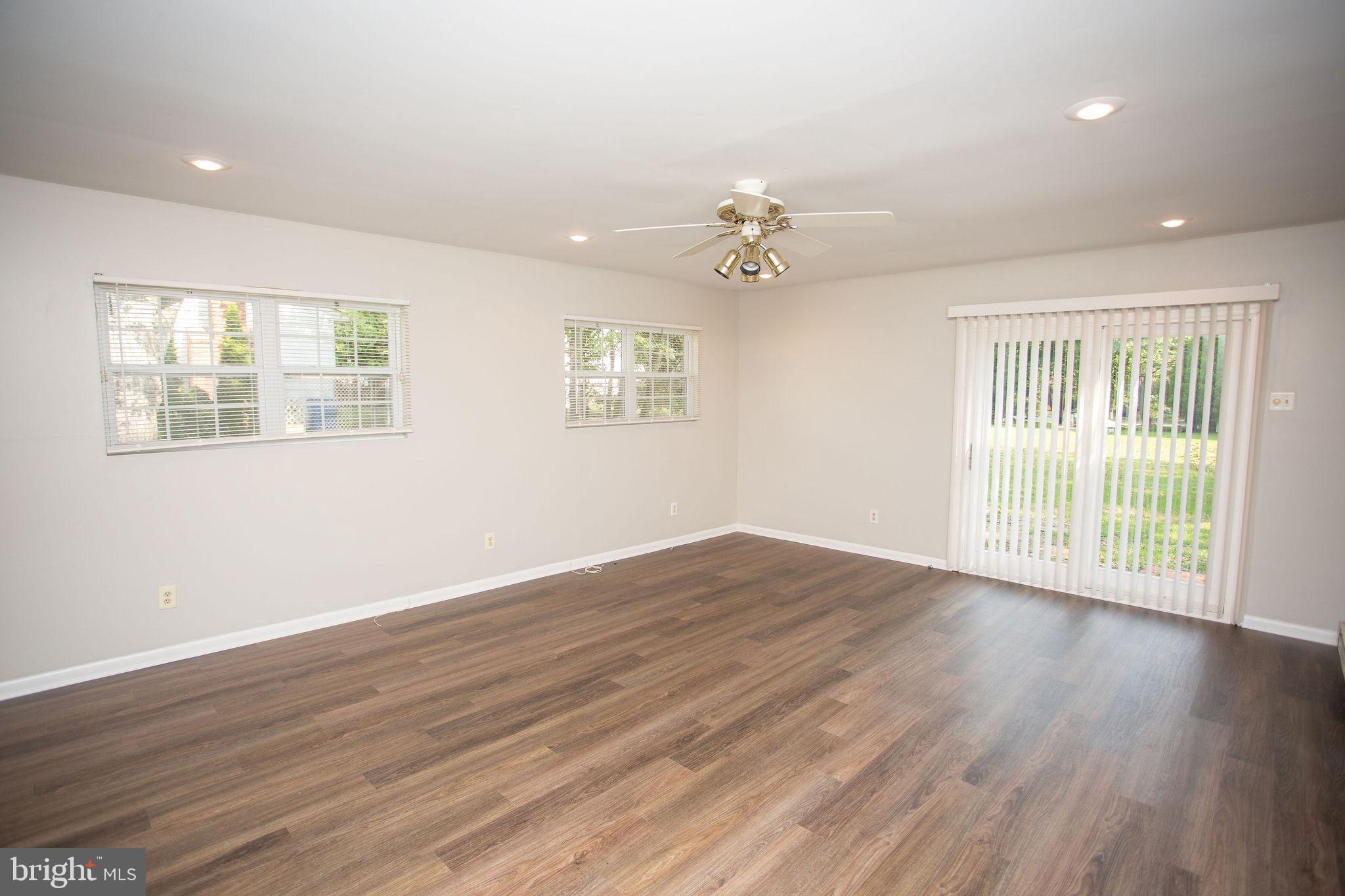 1016 Eagle Lane Cherry Hill, NJ 08003 - Photo 21 of 54 a view of an empty room with a window and wooden floor