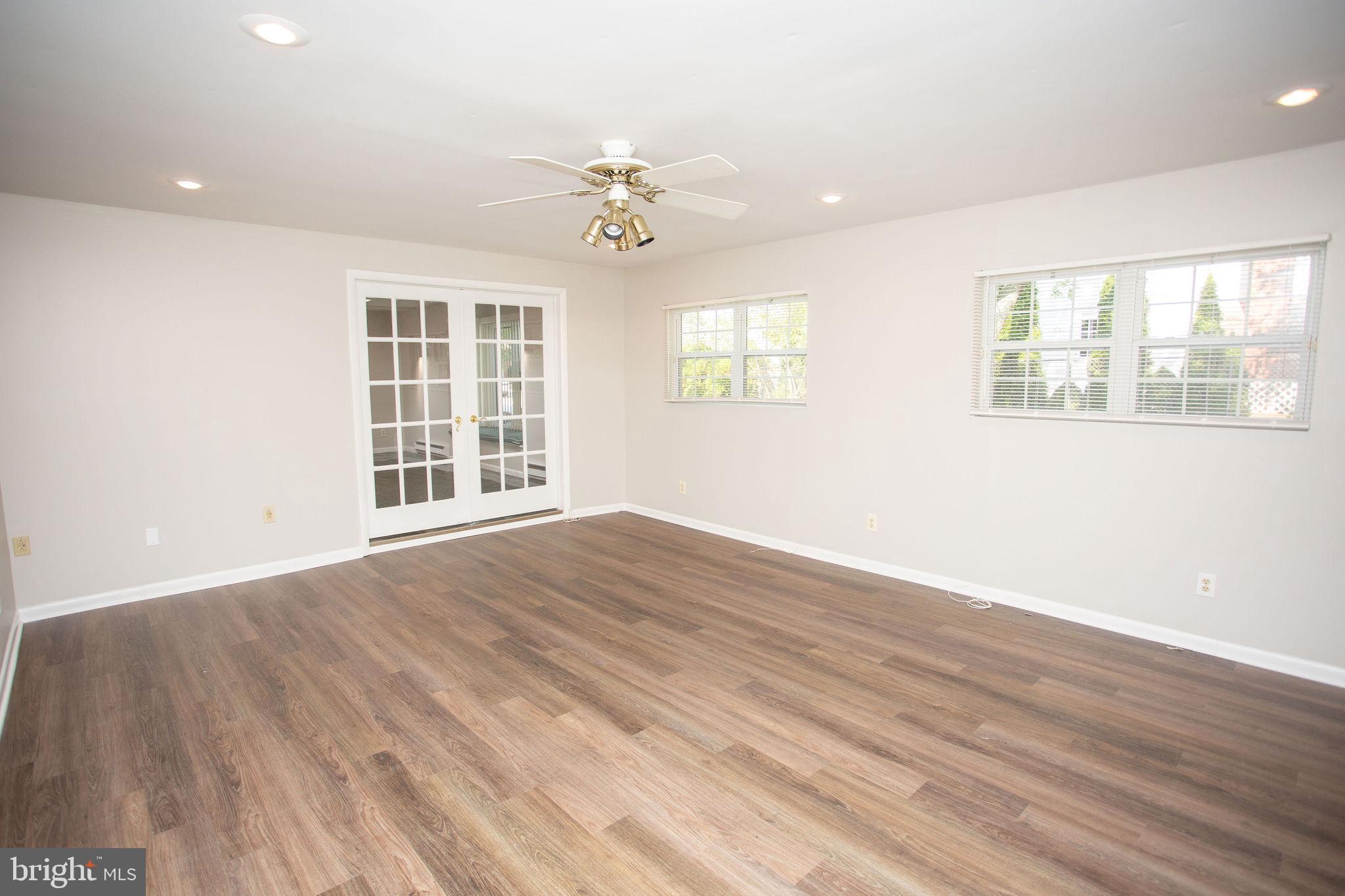 1016 Eagle Lane Cherry Hill, NJ 08003 - Photo 22 of 54 a view of an empty room with wooden floor and a window