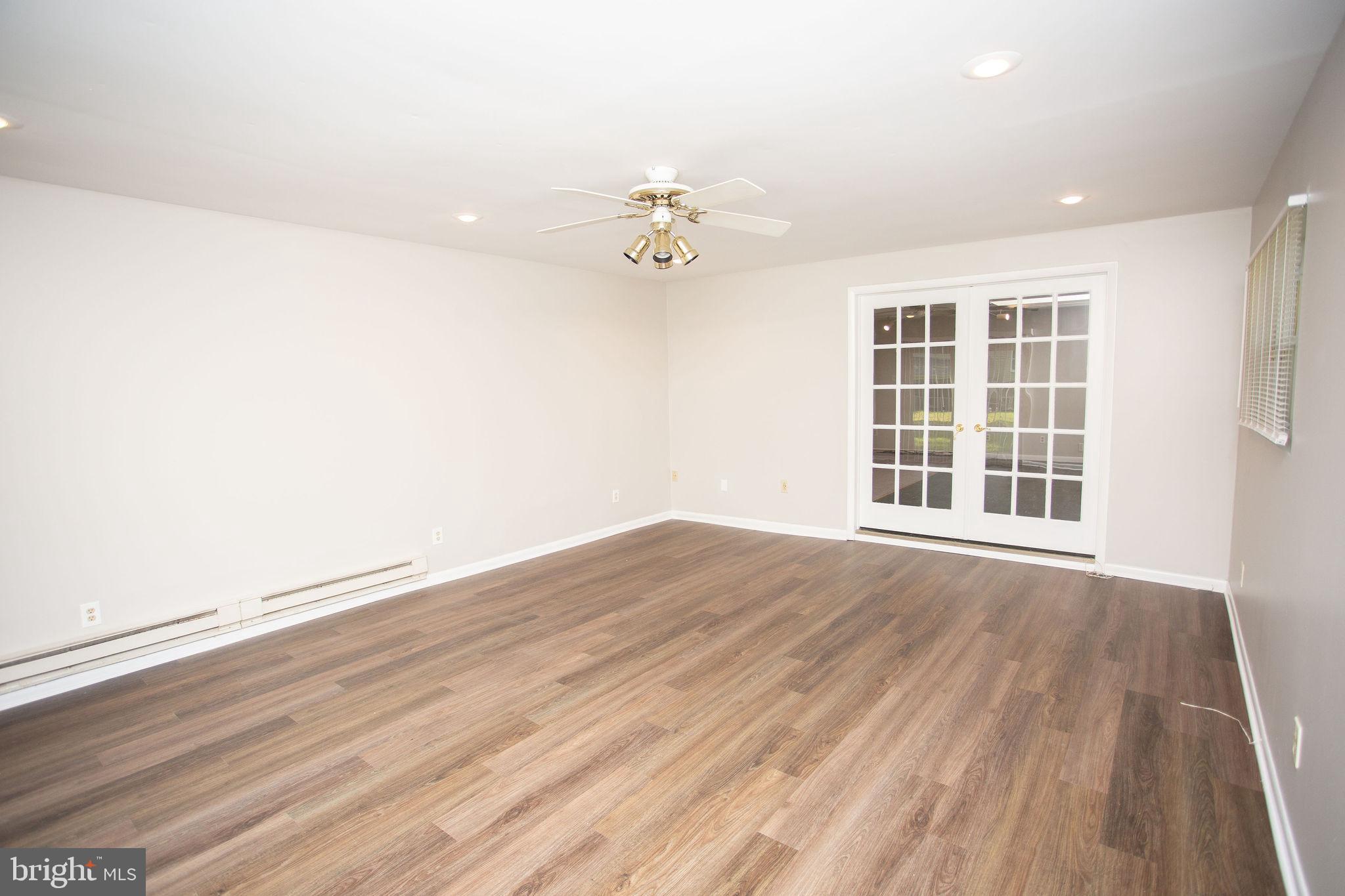 1016 Eagle Lane Cherry Hill, NJ 08003 - Photo 23 of 54 wooden floor in an empty room with a window