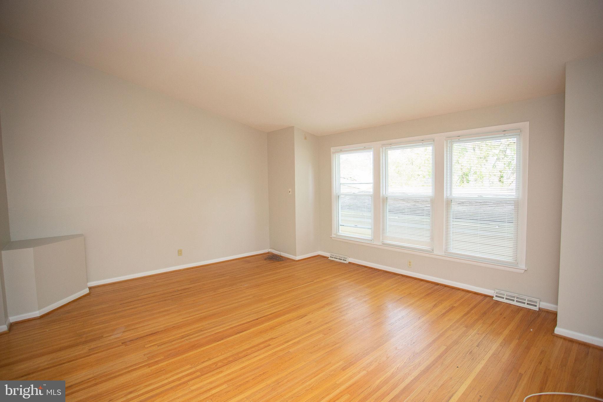 1016 Eagle Lane Cherry Hill, NJ 08003 - Photo 29 of 54 an empty room with wooden floor and windows
