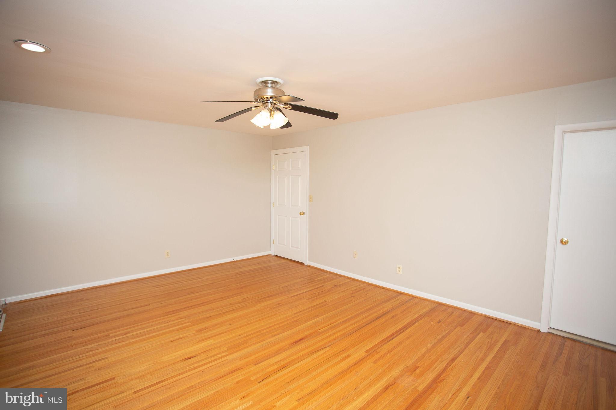 1016 Eagle Lane Cherry Hill, NJ 08003 - Photo 35 of 54 a view of a room with wooden floor and a ceiling fan