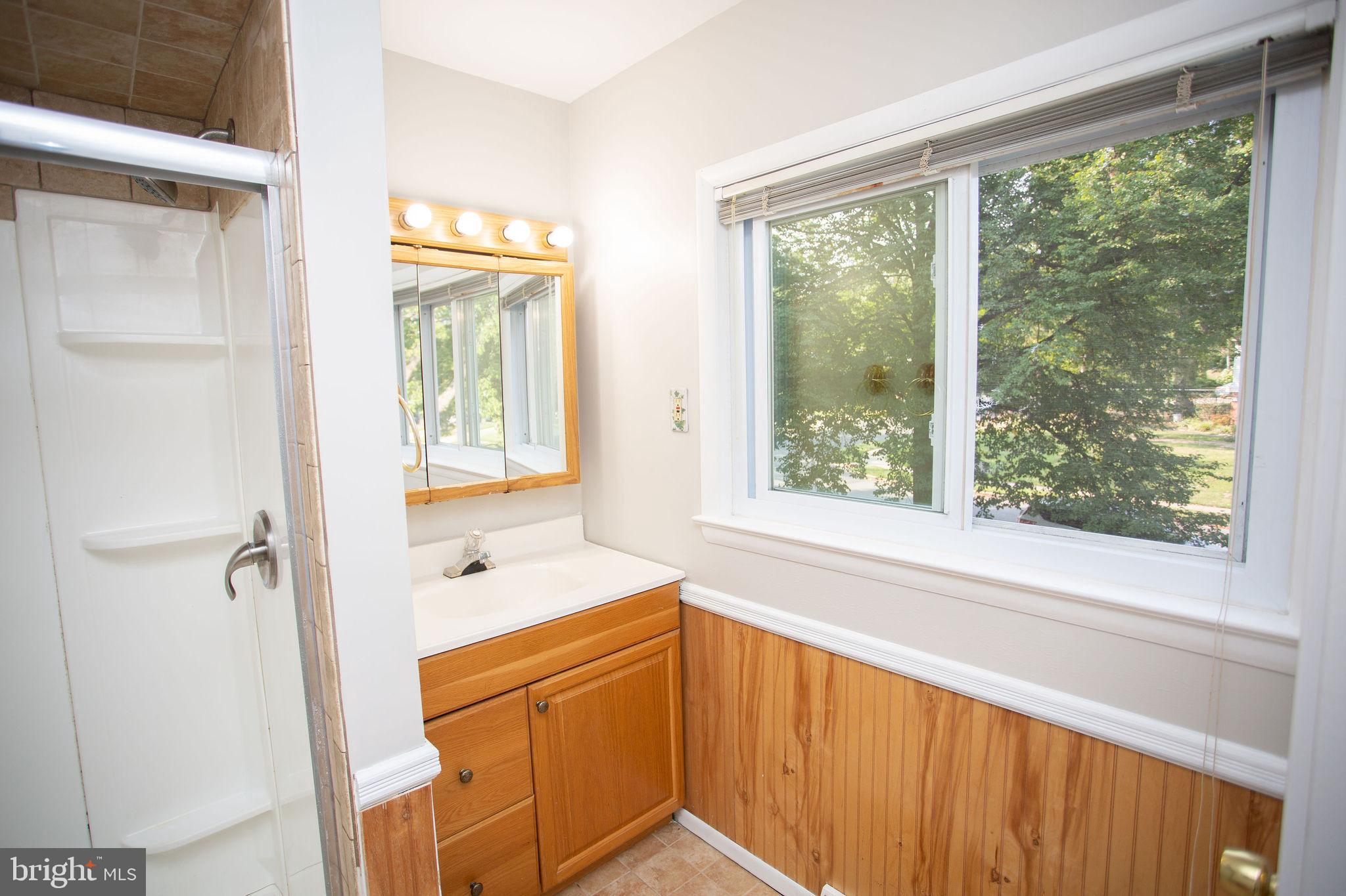 1016 Eagle Lane Cherry Hill, NJ 08003 - Photo 39 of 54 a bathroom with a sink a mirror and a shower