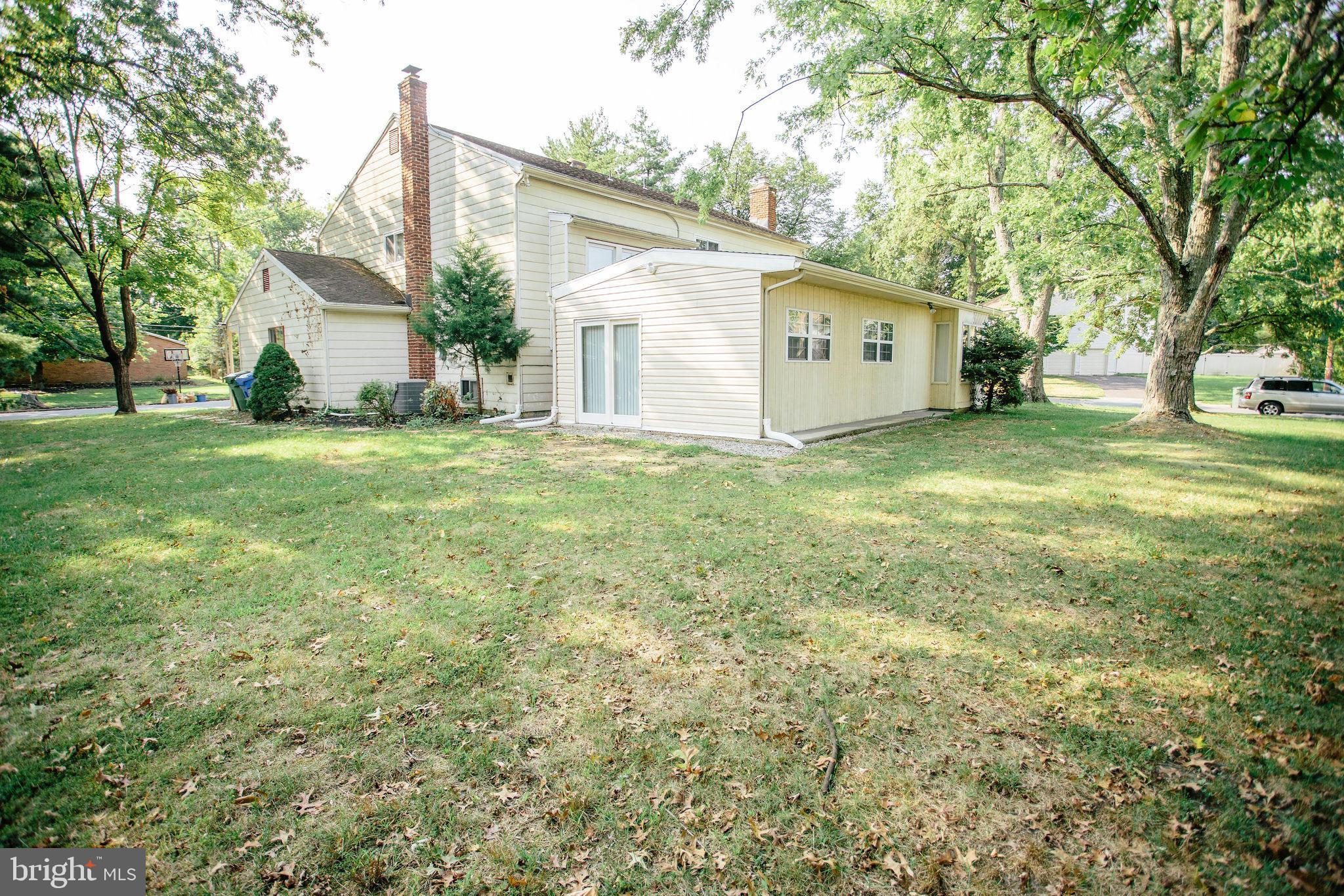 1016 Eagle Lane Cherry Hill, NJ 08003 - Photo 4 of 54 a view of a house with a big yard and large tree