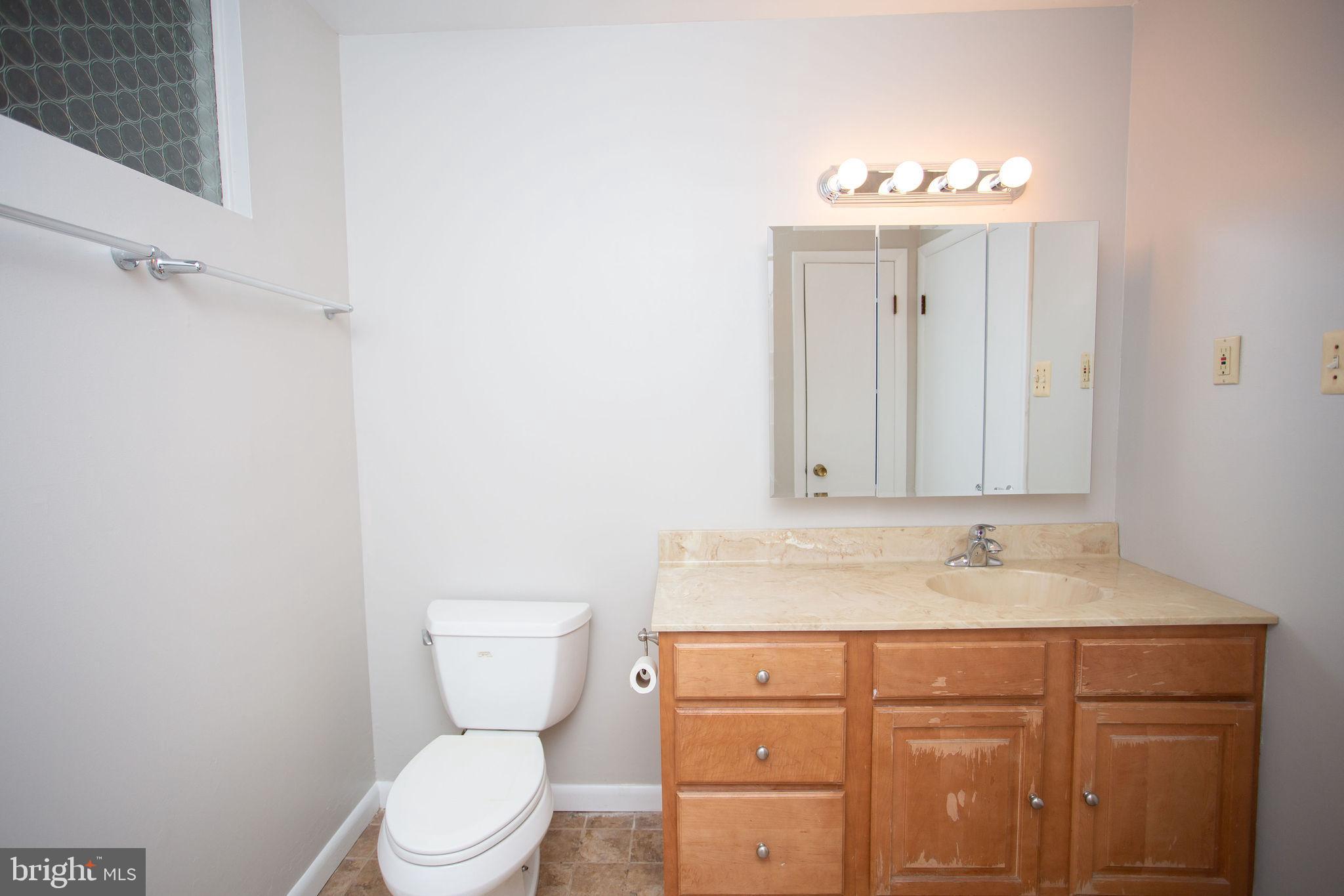 1016 Eagle Lane Cherry Hill, NJ 08003 - Photo 44 of 54 a bathroom with a granite countertop toilet sink and mirror