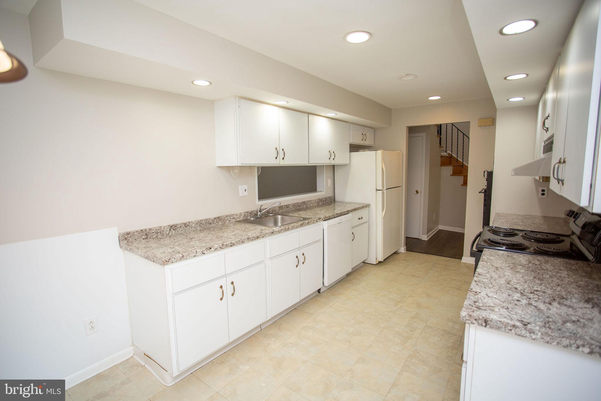 1016 Eagle Lane Cherry Hill, NJ 08003 - Photo 9 of 54 a large kitchen with stainless steel appliances granite countertop a large stove top oven a sink and dishwasher
