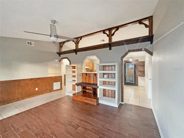a view of an empty room with a fireplace