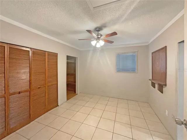 a view of an empty room with a bathroom