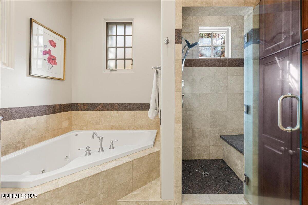6355 Wetzel Court Reno, NV 89511 - Photo 20 of 38 a bathroom with a bathtub and a shower