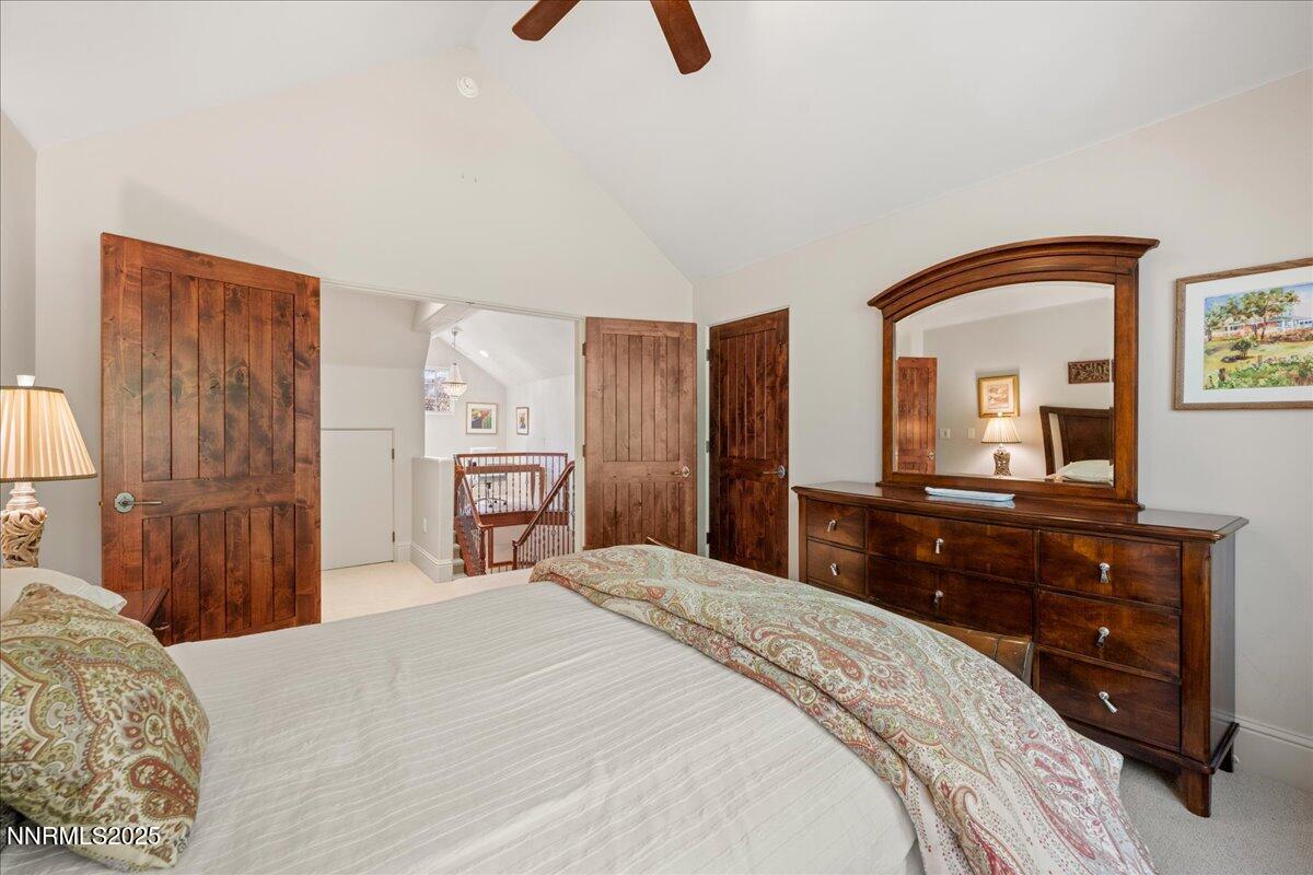 6355 Wetzel Court Reno, NV 89511 - Photo 23 of 38 a bedroom with a bed and a dresser with mirror