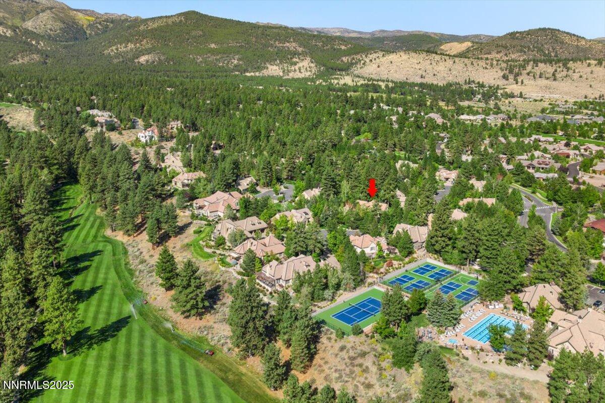 6355 Wetzel Court Reno, NV 89511 - Photo 37 of 38 a view of a lush green field with mountains in the background