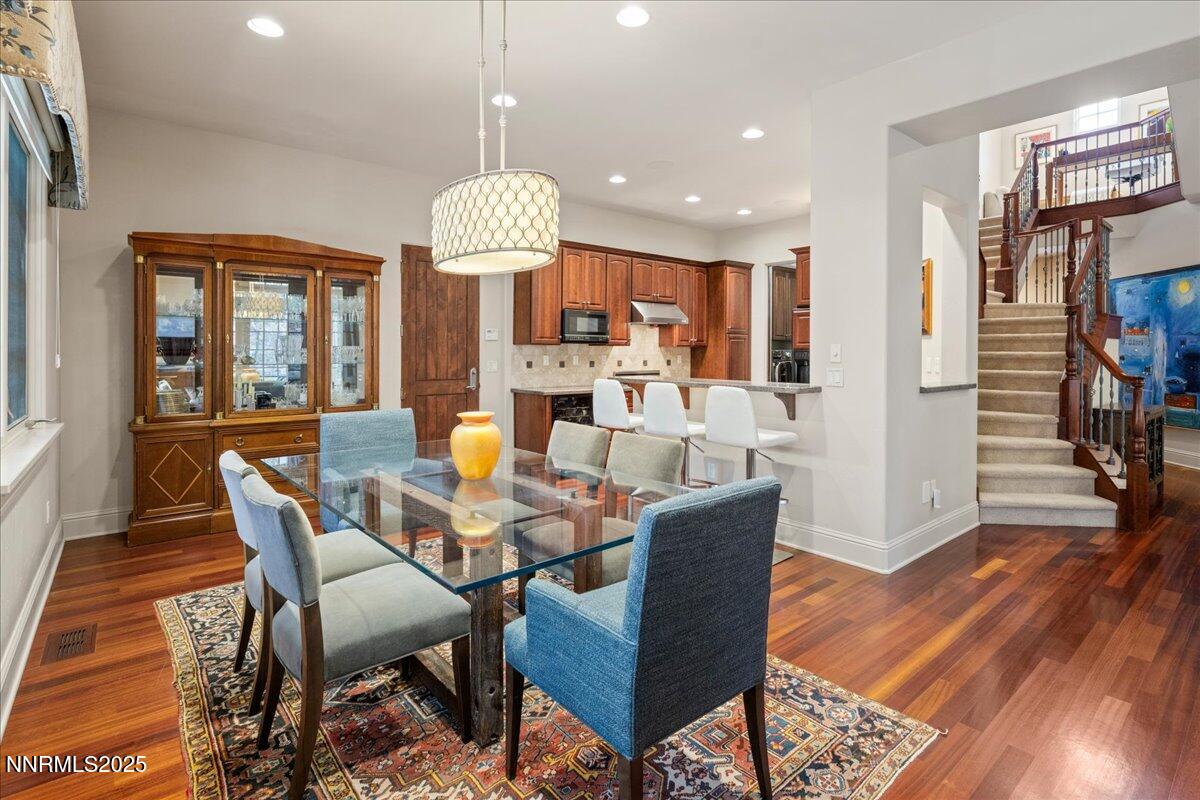 6355 Wetzel Court Reno, NV 89511 - Photo 8 of 38 a view of a dining room with furniture wooden floor and chandelier