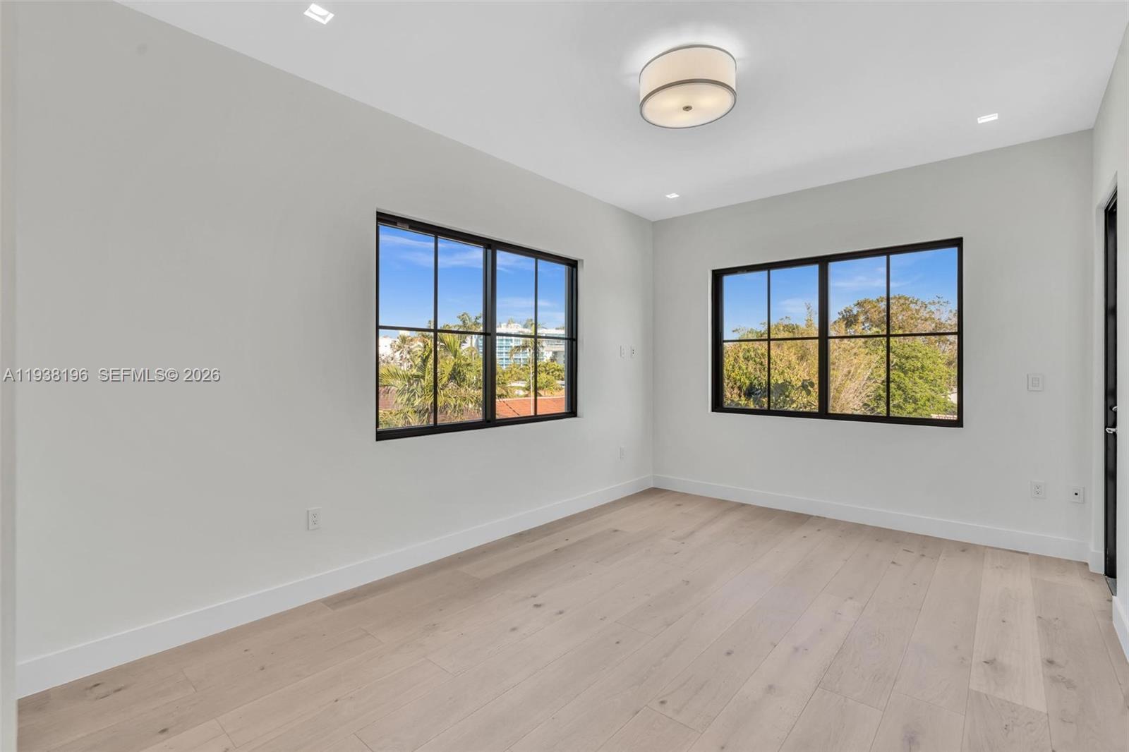 9264 Dickens Avenue Surfside, FL 33154 - Photo 20 of 46 an empty room with windows