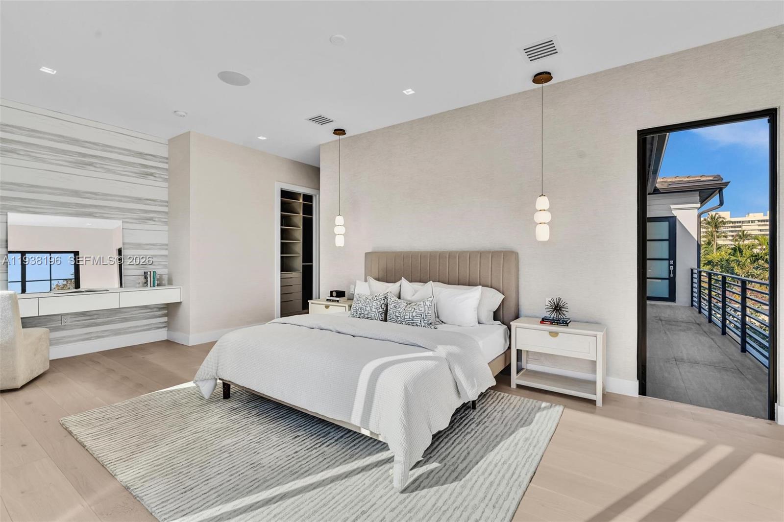 9264 Dickens Avenue Surfside, FL 33154 - Photo 26 of 46 a bedroom with a large bed and a couch