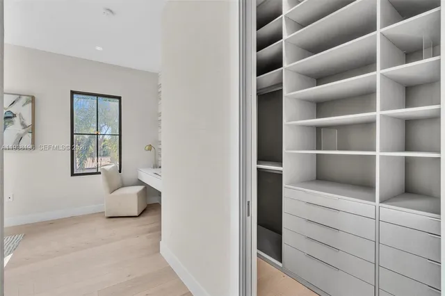 a bathroom with a bathtub sink and mirror