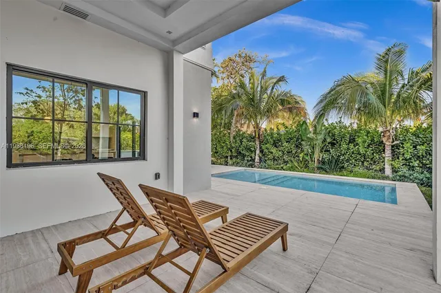 an aerial view of a house with swimming pool