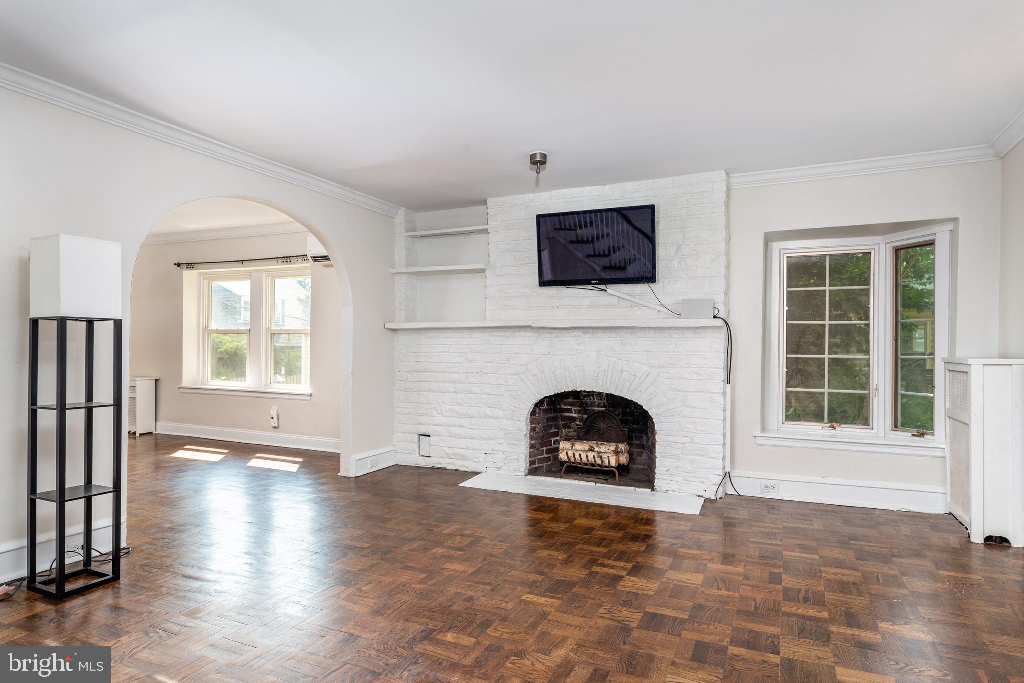 217 Rockglen Road Wynnewood, PA 19096 - Photo 8 of 17 Living Room with Fireplace, Window Seat