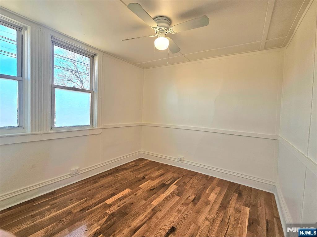 95 Cannonball Road Pompton Lakes, NJ 07442 - Photo 12 of 18 wooden floor in an empty room with a window