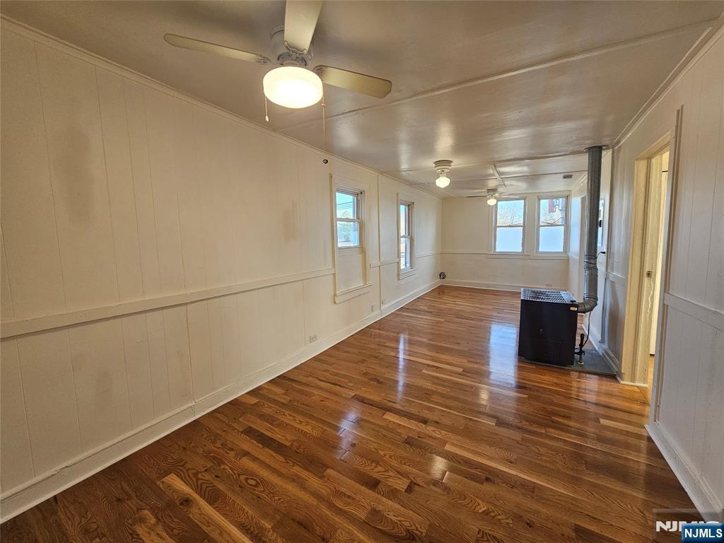 95 Cannonball Road Pompton Lakes, NJ 07442 - Photo 4 of 18 wooden floor in an empty room with a window