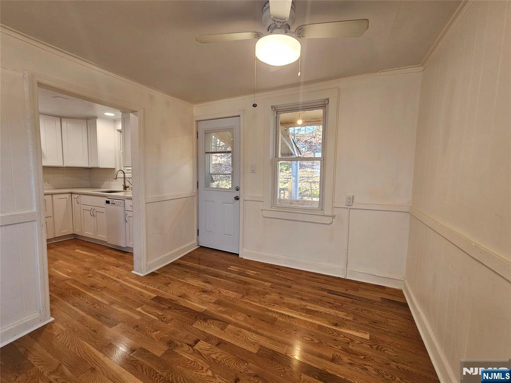95 Cannonball Road Pompton Lakes, NJ 07442 - Photo 6 of 18 a view of a kitchen with wooden floor and windows