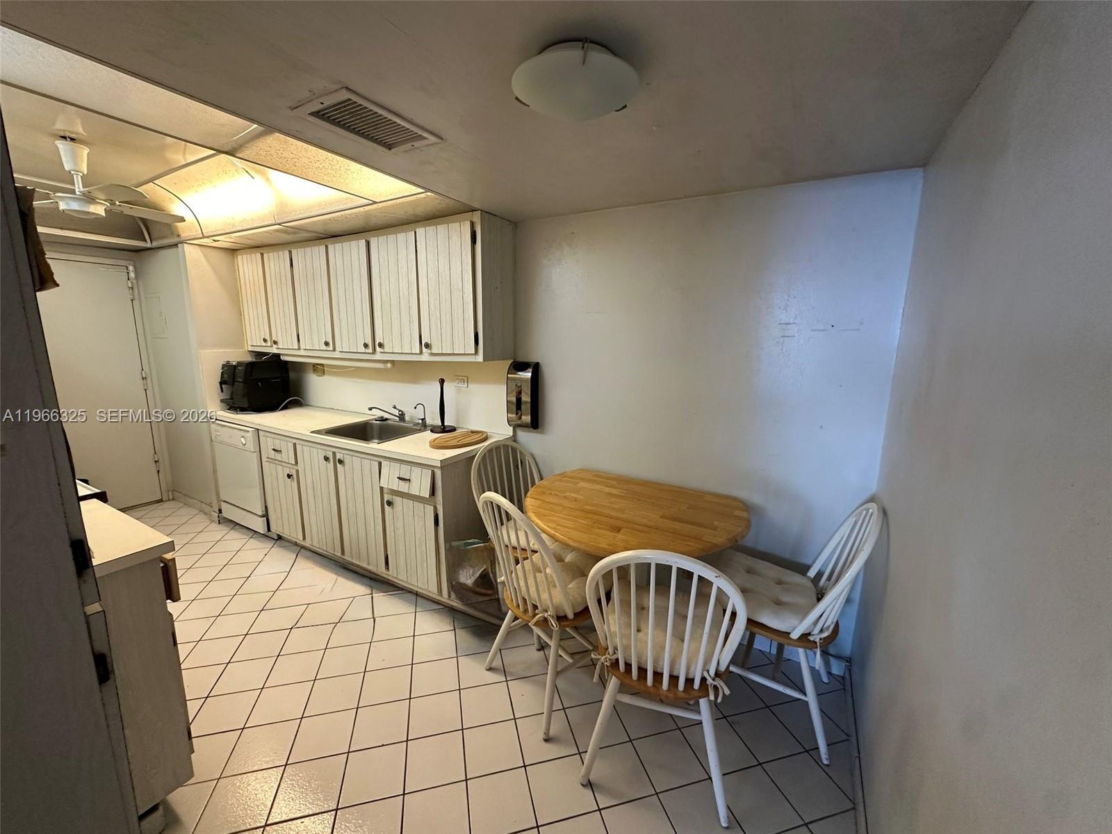 6039 Collins Avenue, Unit 1517 Miami Beach, FL 33140 - Photo 16 of 54 a storage room with washer and dryer
