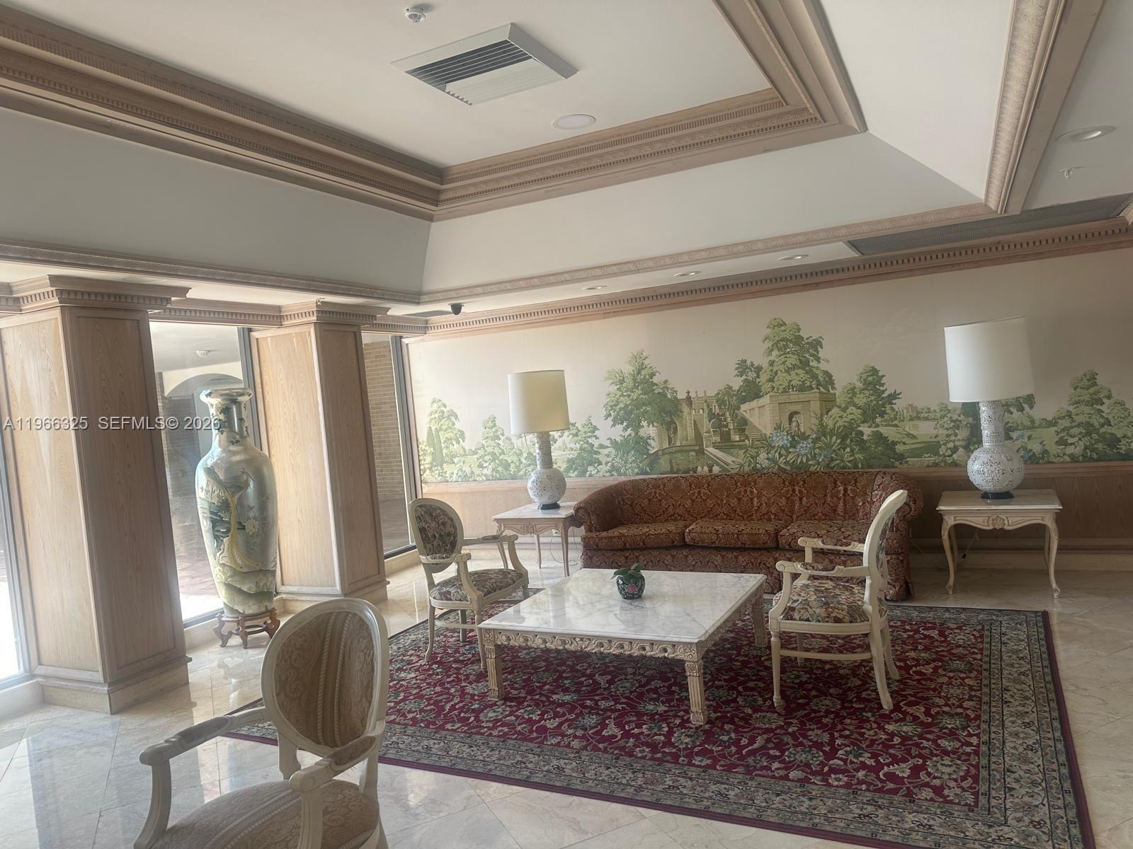 6039 Collins Avenue, Unit 1517 Miami Beach, FL 33140 - Photo 30 of 54 a dining room with furniture a rug and a large window