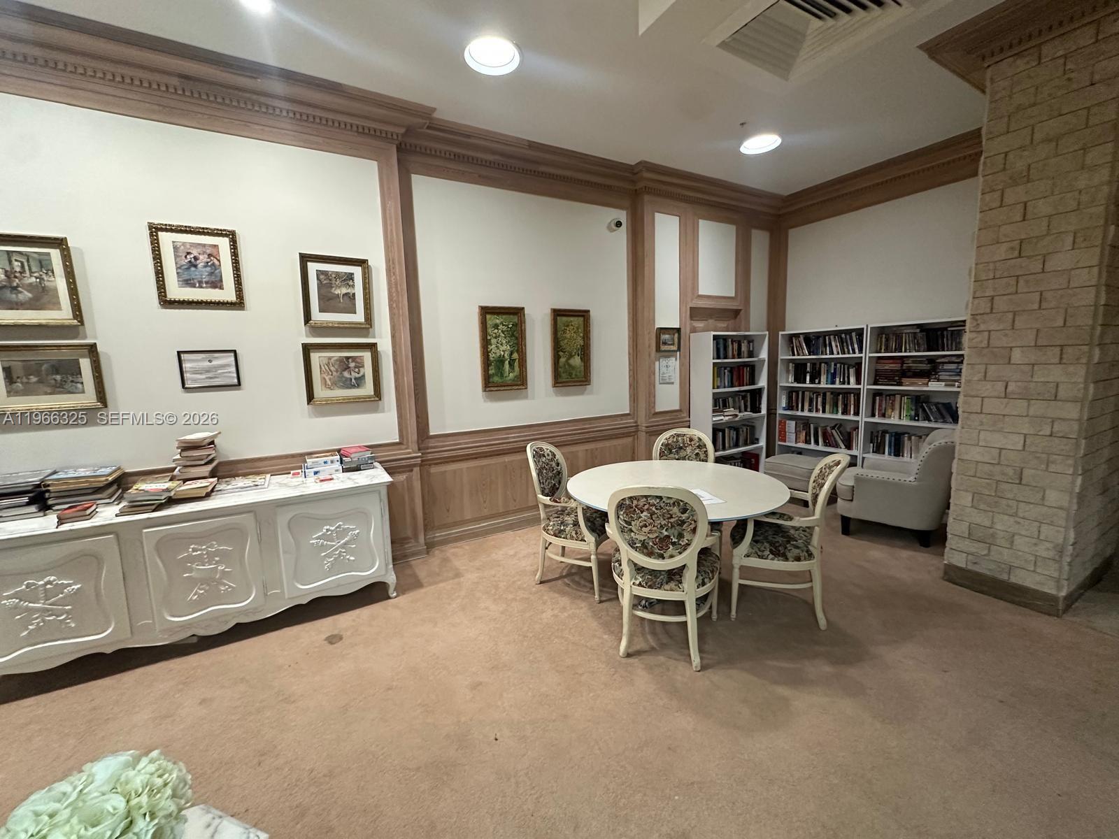 6039 Collins Avenue, Unit 1517 Miami Beach, FL 33140 - Photo 33 of 54 a dining room with furniture and window
