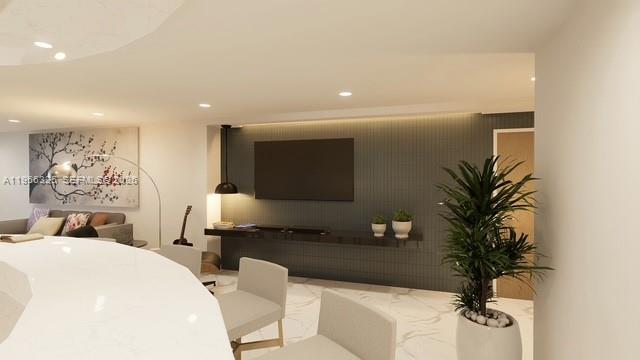 6039 Collins Avenue, Unit 1517 Miami Beach, FL 33140 - Photo 44 of 54 a living room with furniture and a potted plant