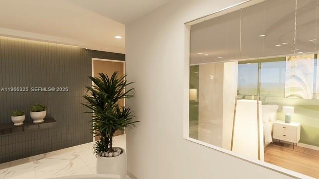 6039 Collins Avenue, Unit 1517 Miami Beach, FL 33140 - Photo 47 of 54 a view of entryway with livingroom and potted plant