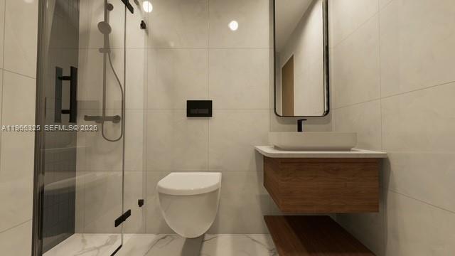 6039 Collins Avenue, Unit 1517 Miami Beach, FL 33140 - Photo 49 of 54 a bathroom with a sink toilet and shower