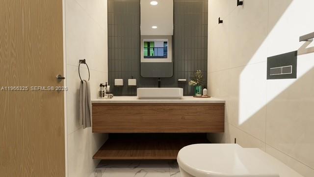 6039 Collins Avenue, Unit 1517 Miami Beach, FL 33140 - Photo 53 of 54 a bathroom with a sink a toilet and mirror