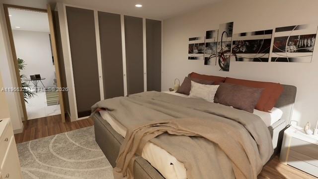 6039 Collins Avenue, Unit 1517 Miami Beach, FL 33140 - Photo 54 of 54 a bedroom with a bed and a walk in closet