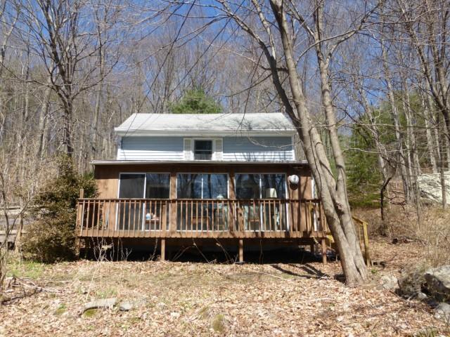 275 Woodville Road Warren, CT 06777 - Photo 1 of 1 a view of wooden house with a yard