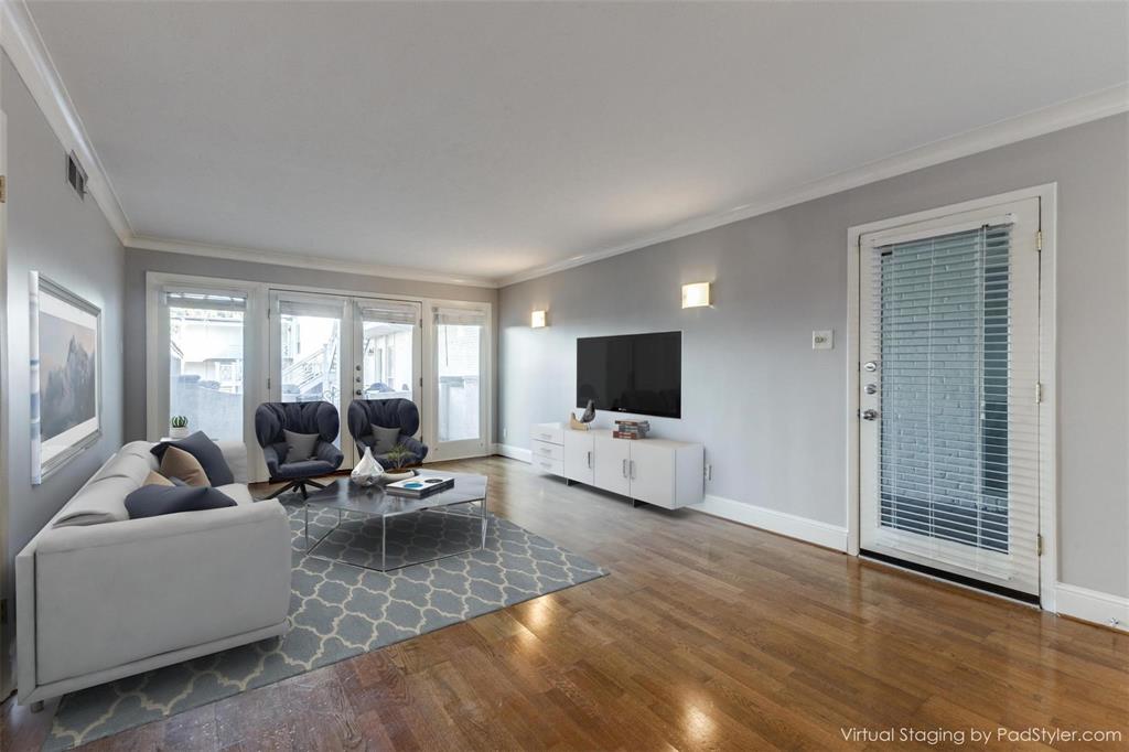 5911 East University Boulevard, Unit 104 Dallas, TX 75206 - Photo 2 of 8 a living room with furniture and a flat screen tv