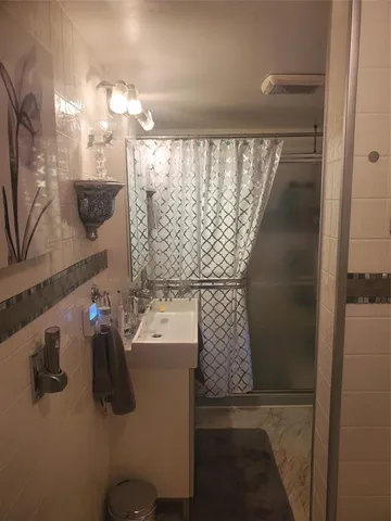 a bathroom with a sink and mirror