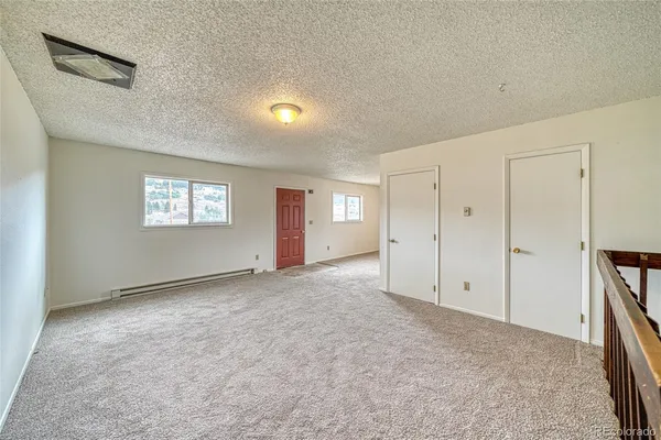 a workspace with furniture and a potted plant