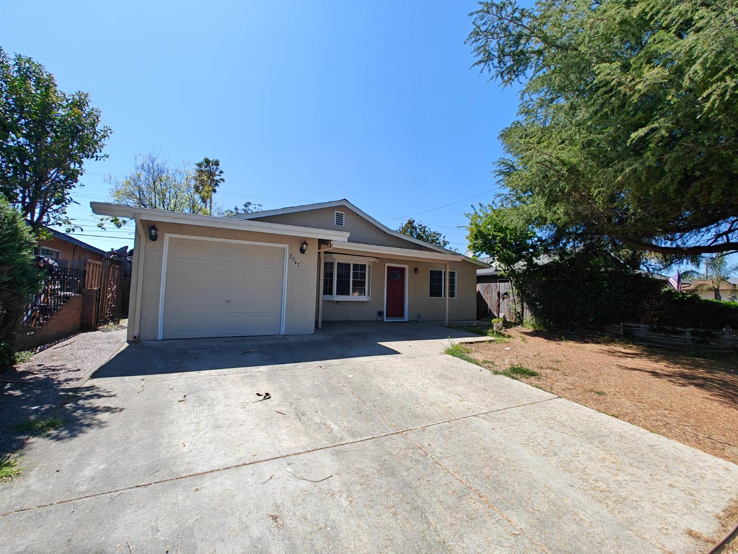2647 Aida Avenue San Jose, CA 95122 - Photo 1 of 19 a front view of a house with a yard and a garage