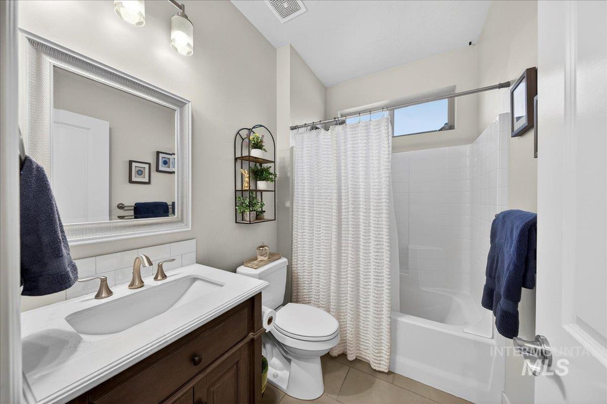 24813 Valley Run Place Star, ID 83669 - Photo 24 of 50 Full bath featuring shower / bath combo, vanity, and light tile patterned floors