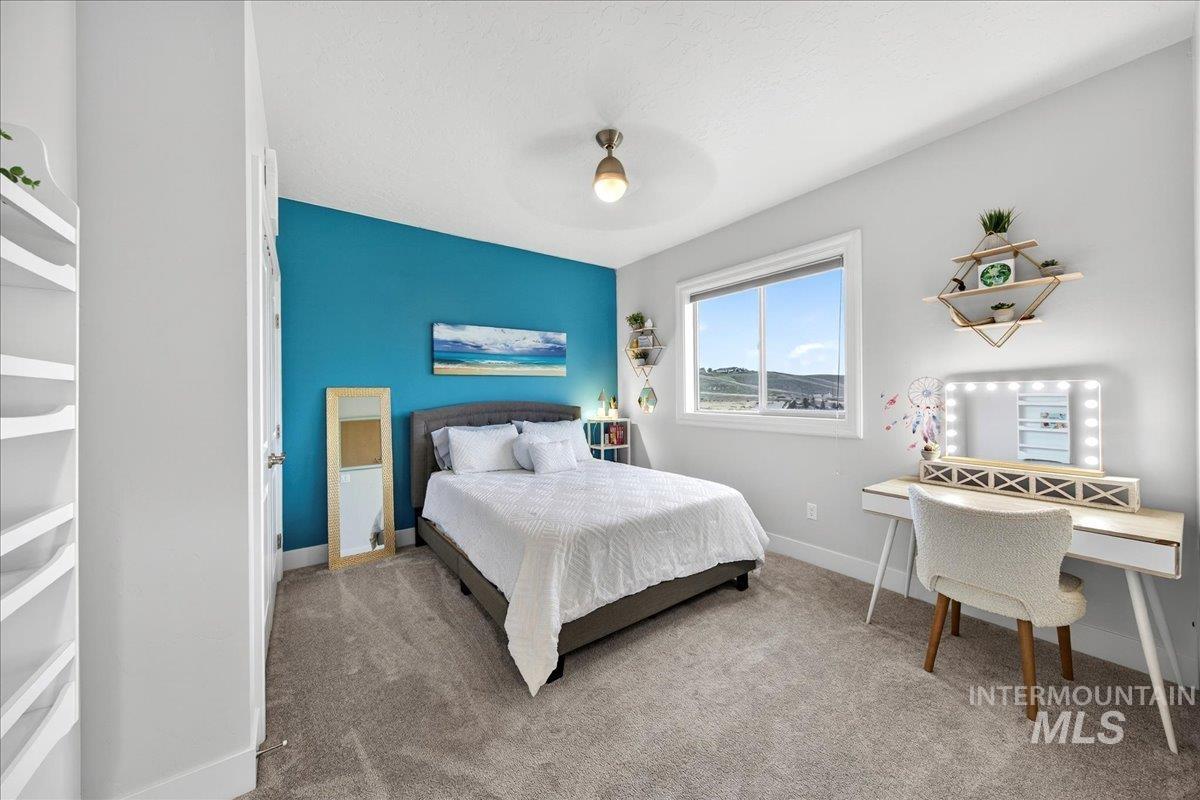 24813 Valley Run Place Star, ID 83669 - Photo 25 of 50 Carpeted bedroom with ceiling fan and baseboards