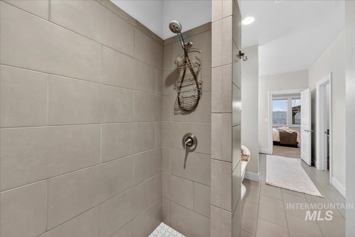 24813 Valley Run Place Star, ID 83669 - Photo 33 of 50 Ensuite bathroom featuring walk in shower, recessed lighting, and light tile patterned flooring