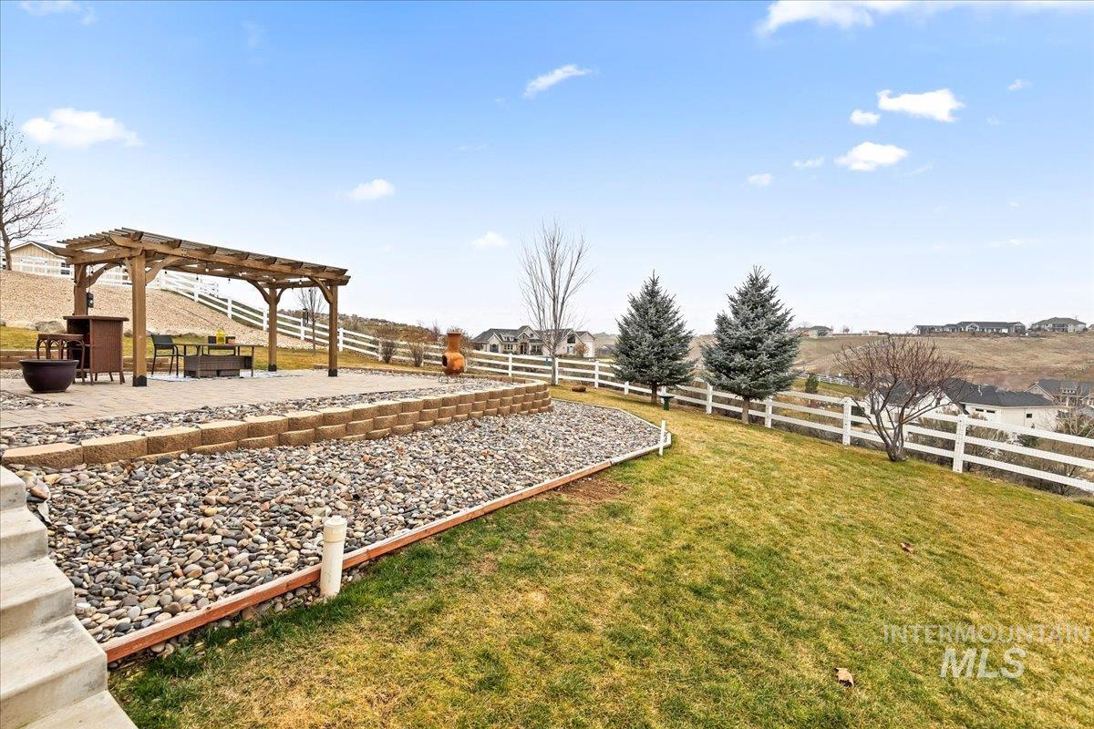 24813 Valley Run Place Star, ID 83669 - Photo 40 of 50 Fenced backyard featuring a pergola and a patio area