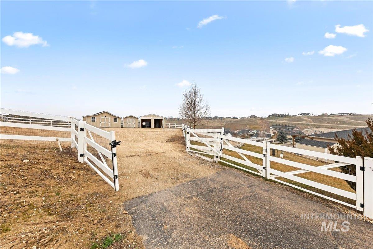 24813 Valley Run Place Star, ID 83669 - Photo 41 of 50 View of yard with a rural view and a gate