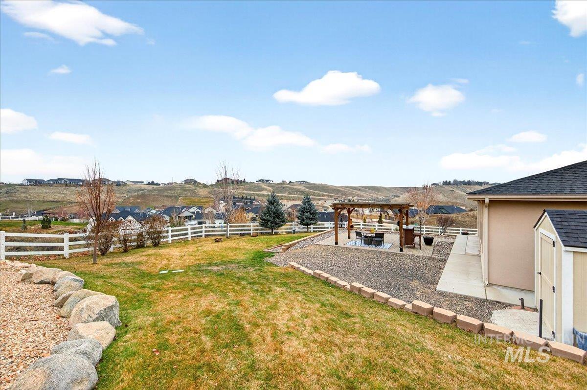 24813 Valley Run Place Star, ID 83669 - Photo 45 of 50 Fenced backyard with a patio area, a pergola, and a shed