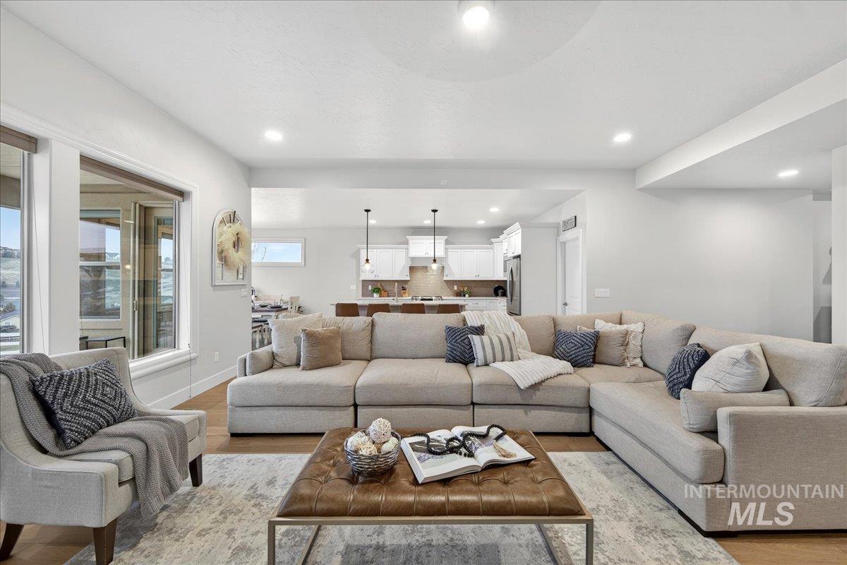 24813 Valley Run Place Star, ID 83669 - Photo 9 of 50 Living room with wood finished floors and recessed lighting